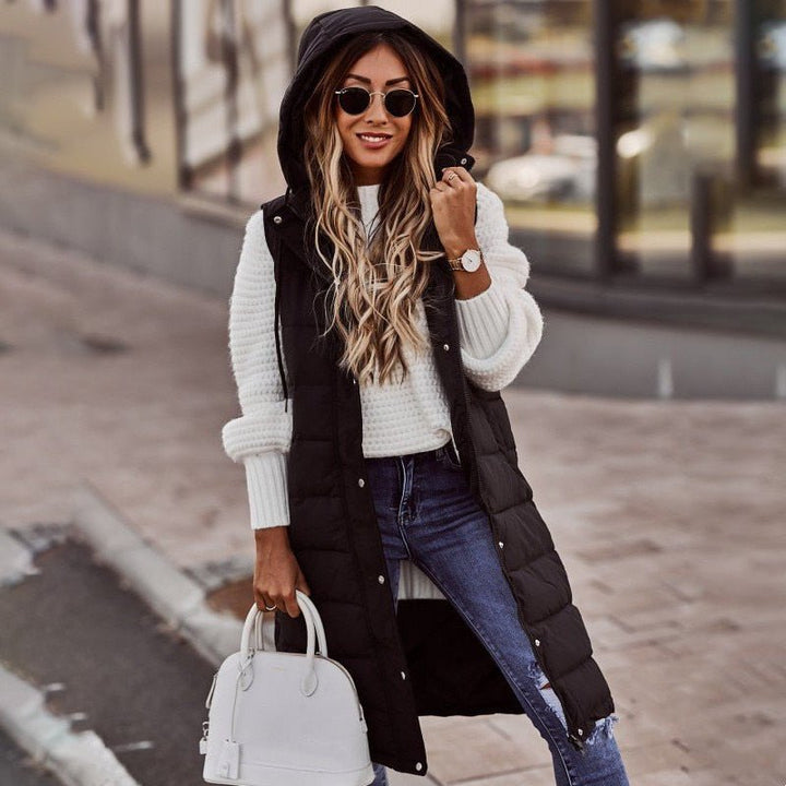 Women's quilted knee-length bodywarmer vest in black, ideal for winter warmth & stylish layering.