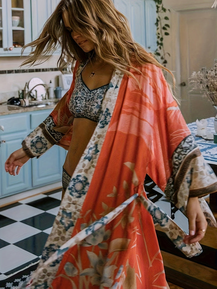 Women's red floral print kimono, a stylish summer beach cover-up for any vacation.