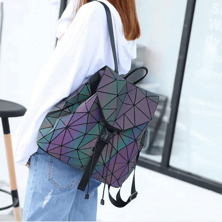 Geometric reflective women's backpack on a white background, highlighting its unique texture
