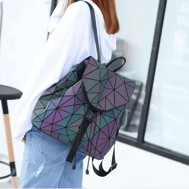 Geometric reflective women's backpack on a white background, highlighting its unique texture