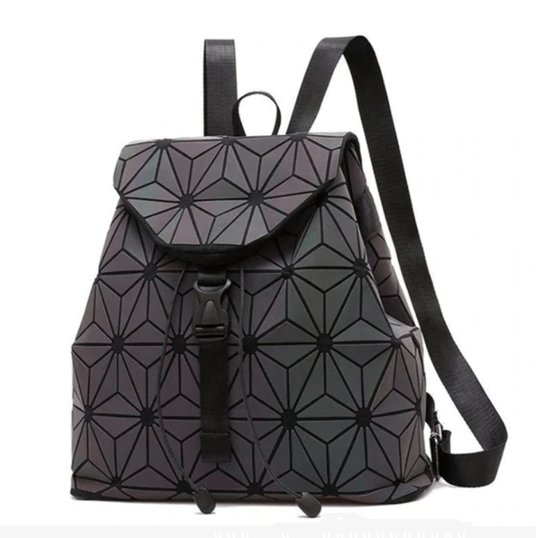 Reflective geometric backpack for women, showcasing its luminous effect and modern design