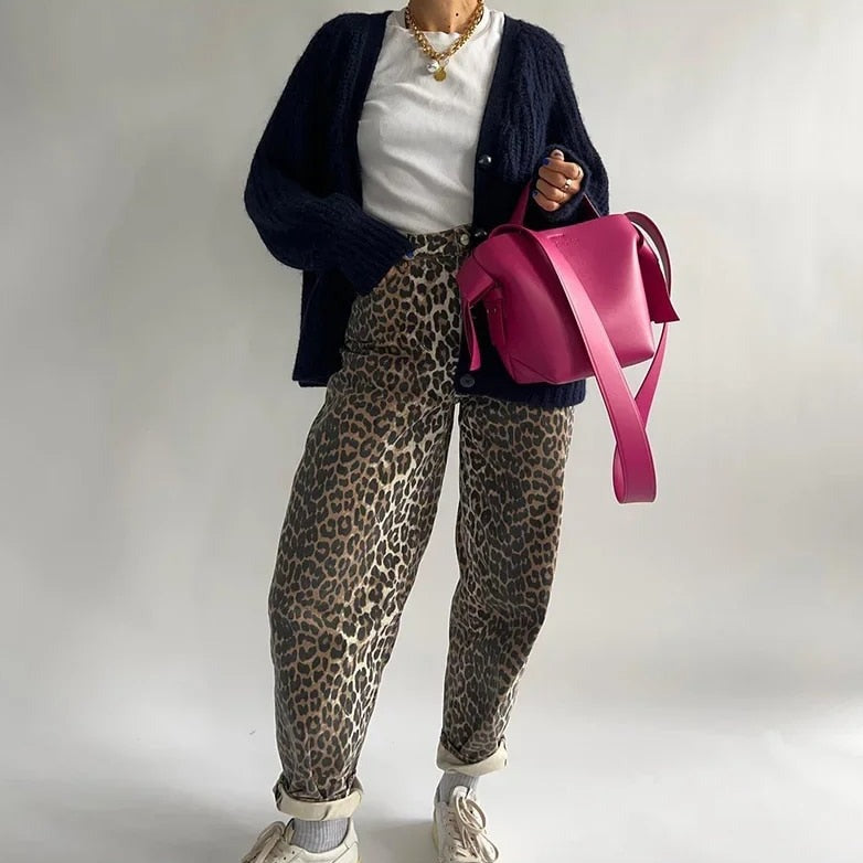 Classic retro women's jeans with a distinctive leopard print, high-waisted for a vintage fashion look.