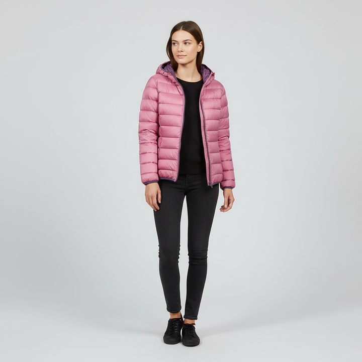 Folded packable women's down jacket, Nina, demonstrating its convenience for travel and storage.
