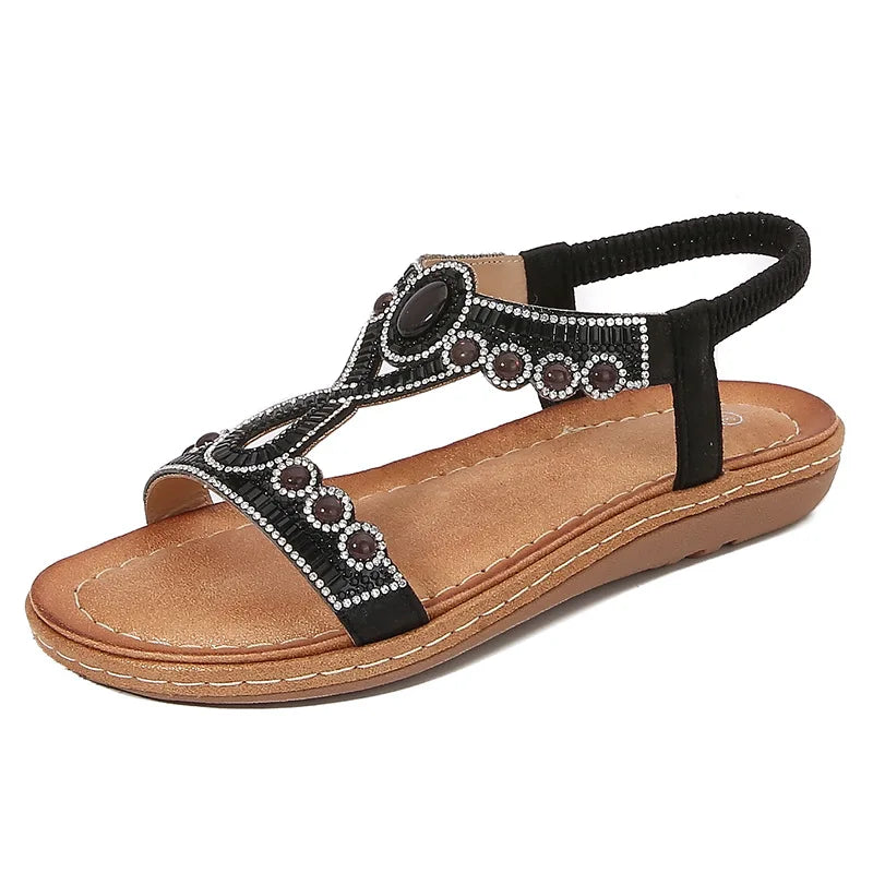 Stylish women's summer flat sandals adorned with glitter and shining rhinestones for leisure