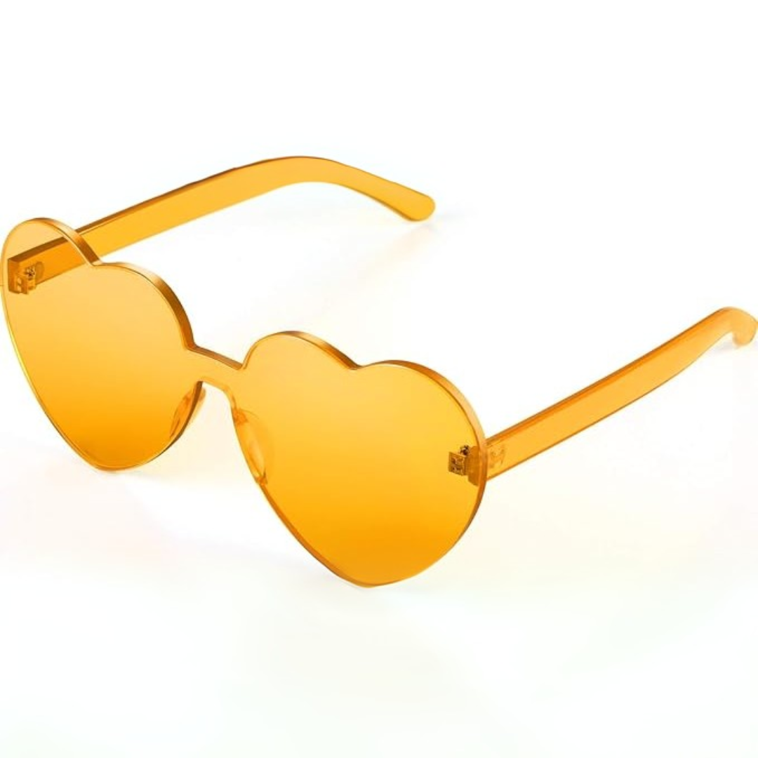 Chic heart-shaped transparent sunglasses for women, rimless design with a vibrant pink-yellow blend, ideal for festival fashion.