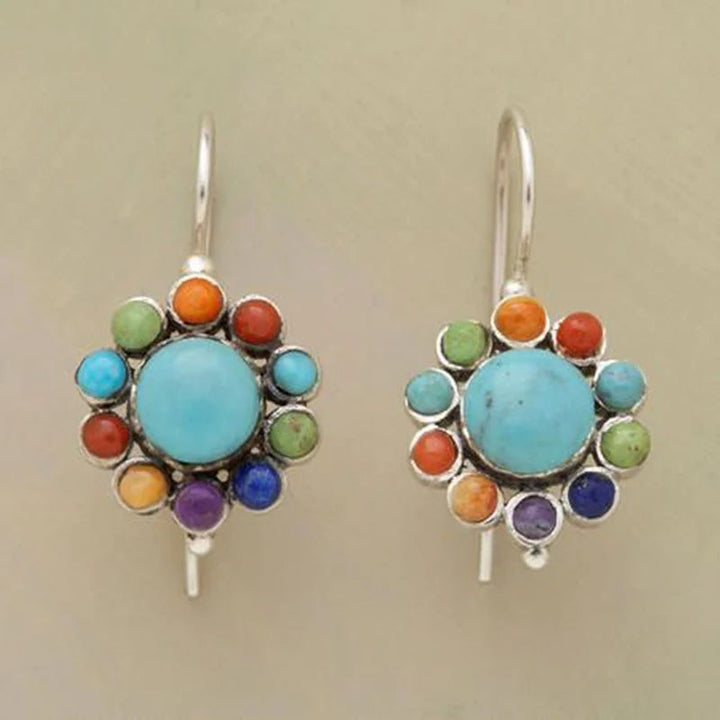 Women's round turquoise earrings with vibrant colorful design, perfect statement jewelry for boho fashion.