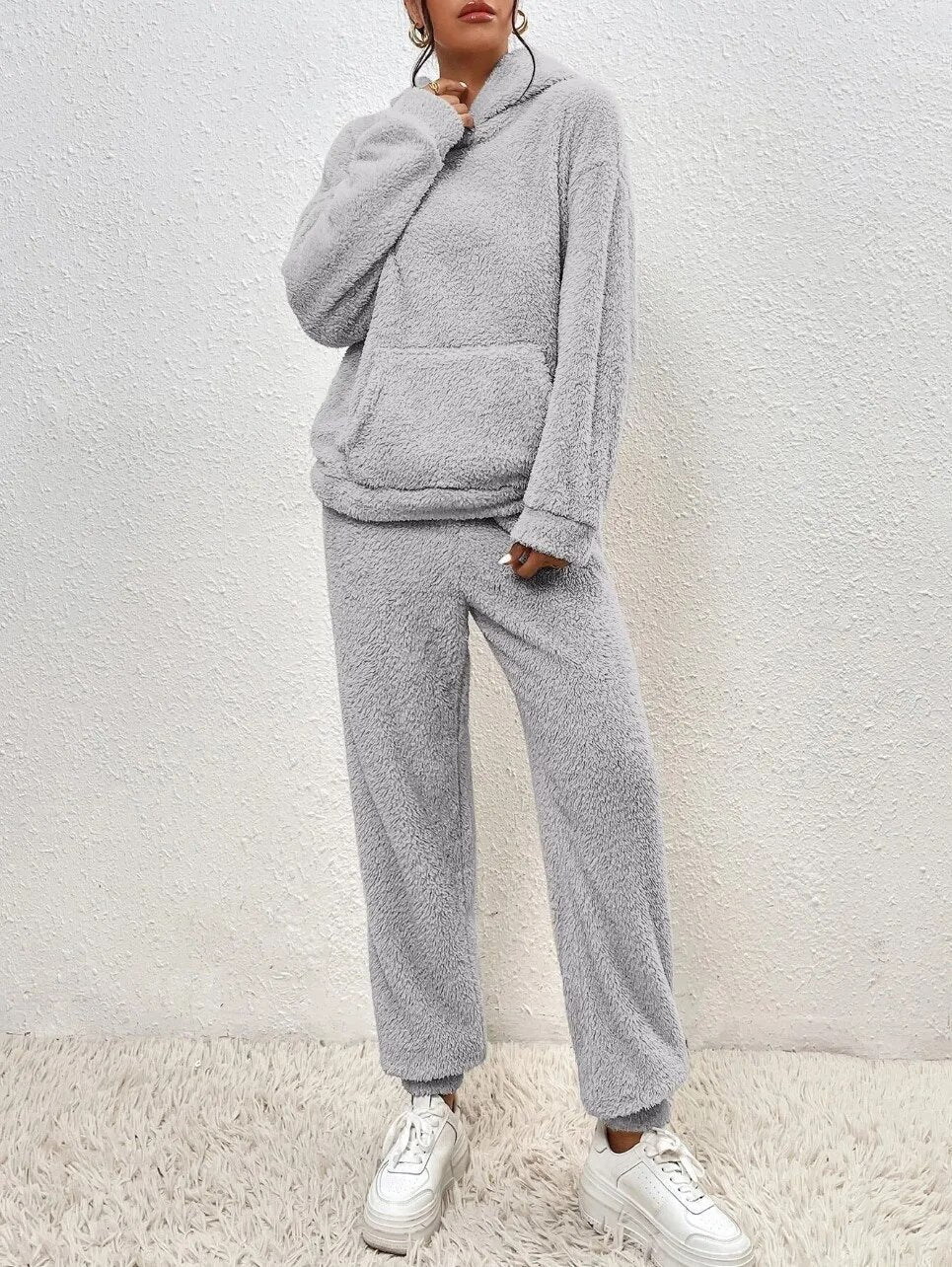 Matching women's hoodie and trouser set in plush teddy fabric, offering ultimate comfort for loungewear