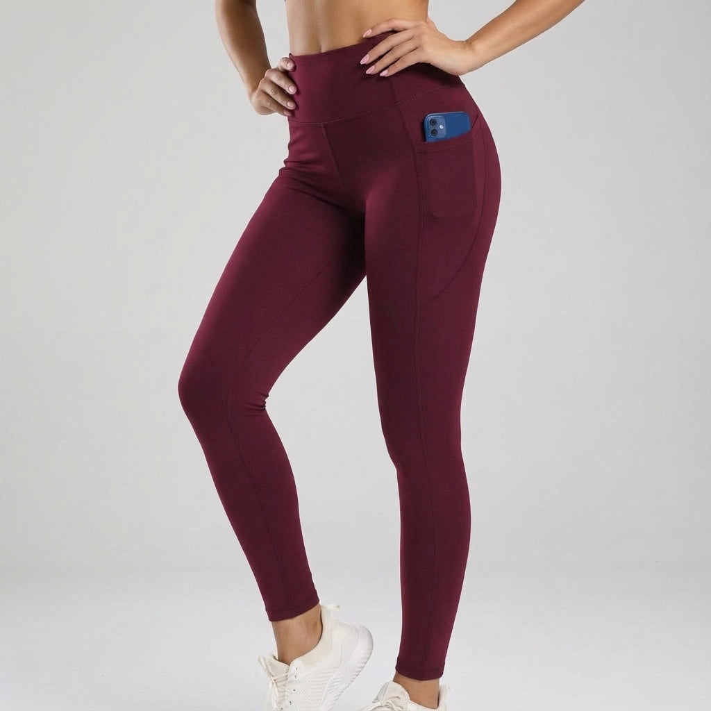 Detail of the seamless fabric and high waistband of black workout leggings with pockets