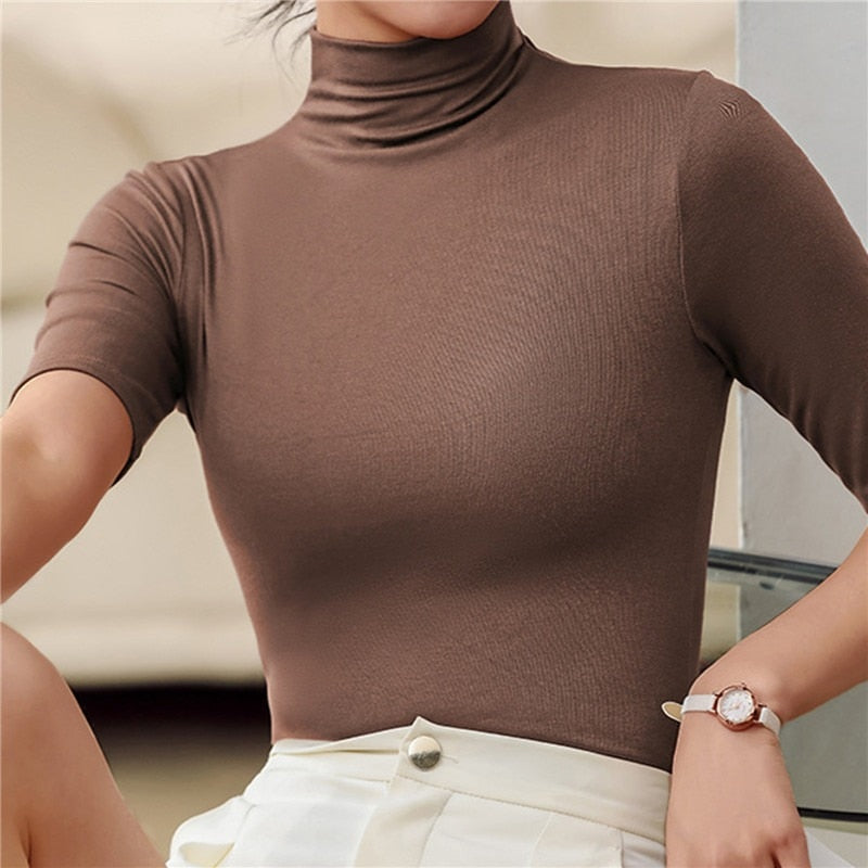 Figure-hugging seamless roll neck top for women. Soft, long sleeve, flattering fit for all body types, including plus size.