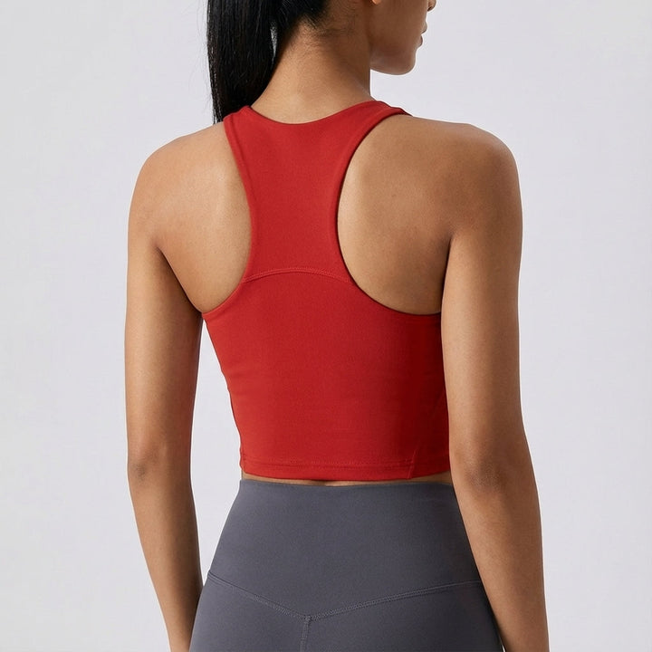 Black seamless crop top for women, featuring removable pads, versatile for gym and activewear.