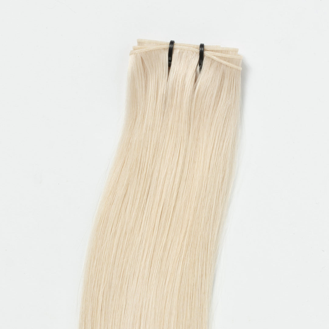 Women's seamless weft hair extension, Light Ash Blonde 60B, for added volume & length. Invisible design.