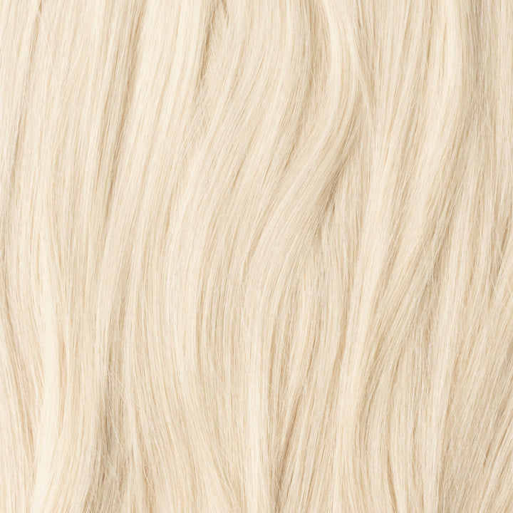 Invisible seamless weft hair extensions, Light Ash Blonde 60B, for natural-looking volume & hair lengthening.