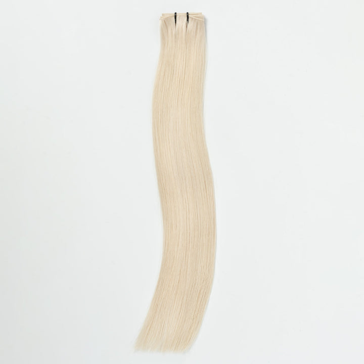 Blonde 60B light ash seamless hair extension strip, invisible for volume & natural-looking length.