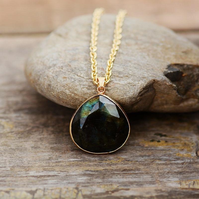 Close-up of a mystical Labradorite Aura gemstone necklace, offering spiritual protection & intuition.