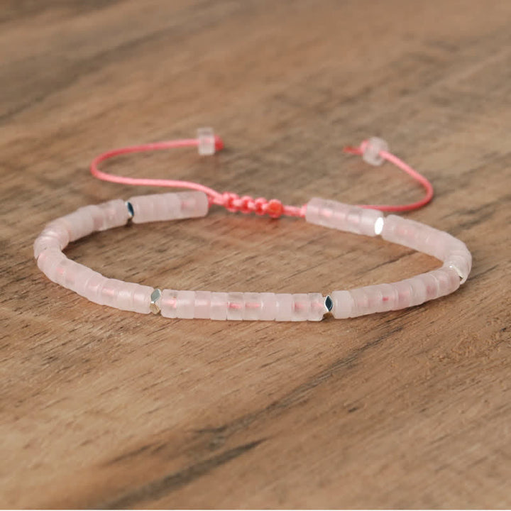 Adjustable Seraphina bracelet for women, with braided band and small natural stone rollers.