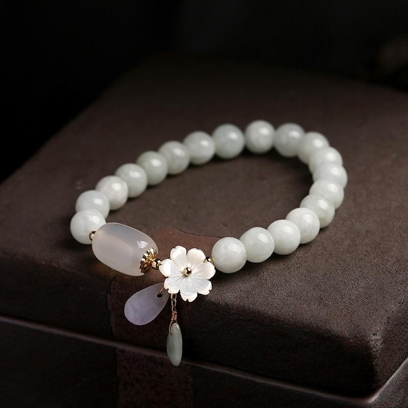 Close-up of Serenity Jade Bracelet, featuring luminous green jade and delicate white crystal agate beads