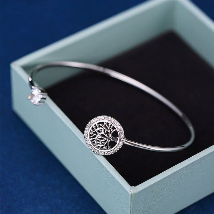 Symbolic gold Tree of Life adjustable bracelet for women's jewelry collection, promoting growth & connection.
