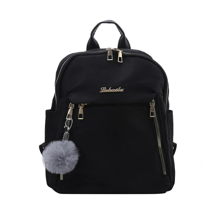 Stylish women's travel backpack in black PU leather, perfect for carrying essentials.