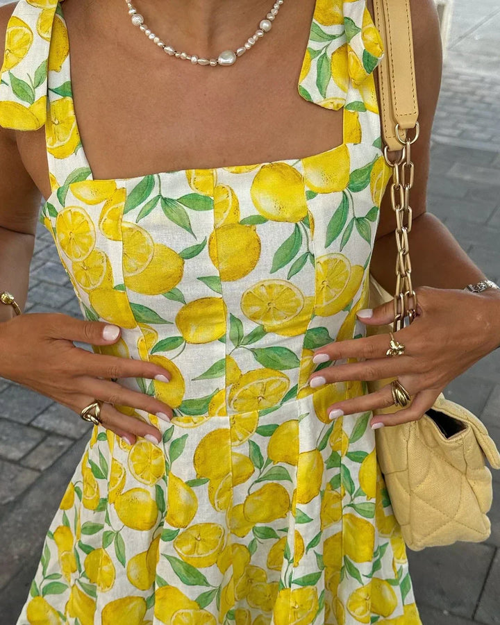 Cheerful women's lemon print day dress. A sleeveless summer design, great for vacation, casual outings, or beachwear.