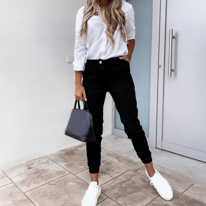 Stylish women's black slim fit pants designed for all-season wear, combining comfort and a sleek look.