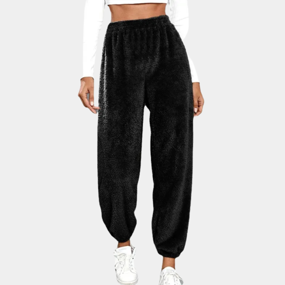 Cozy women's lounge pants with a soft, relaxed fit. Ideal for comfortable everyday wear. Features an elastic waist.