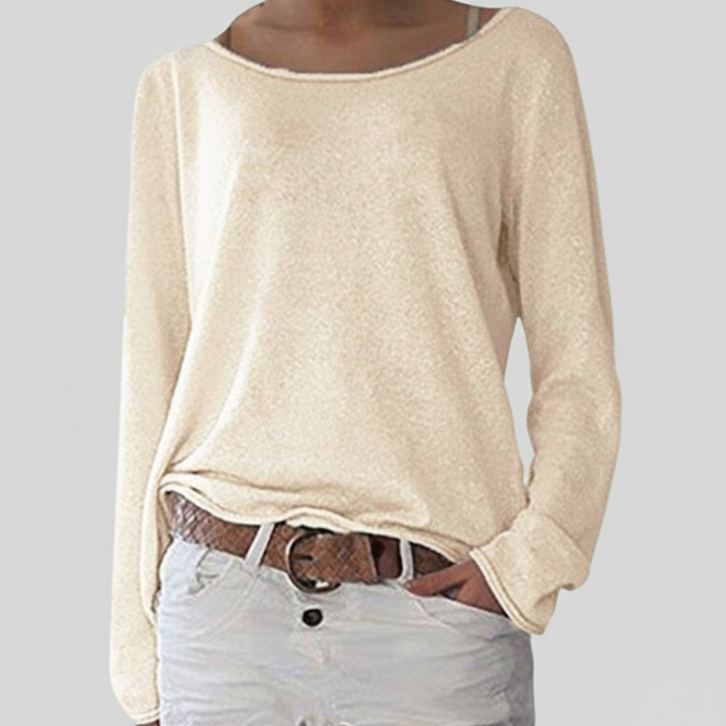 Model wearing a women's long sleeve crewneck sweater, showcasing its relaxed fit and soft texture