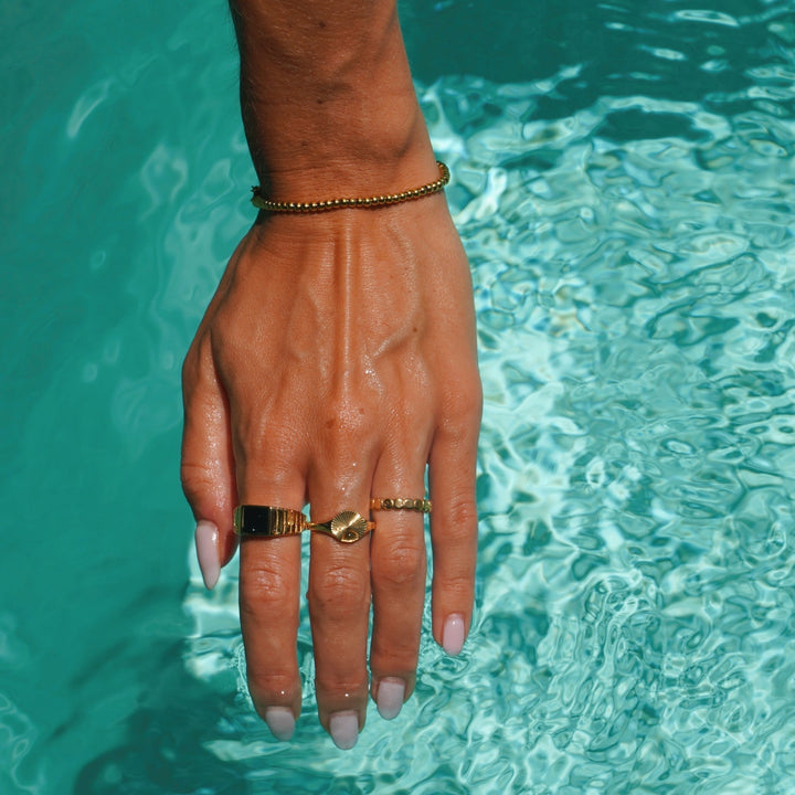 Stylish women's Solara Sun Signet Ring, a versatile gold & silver piece for daily wear.