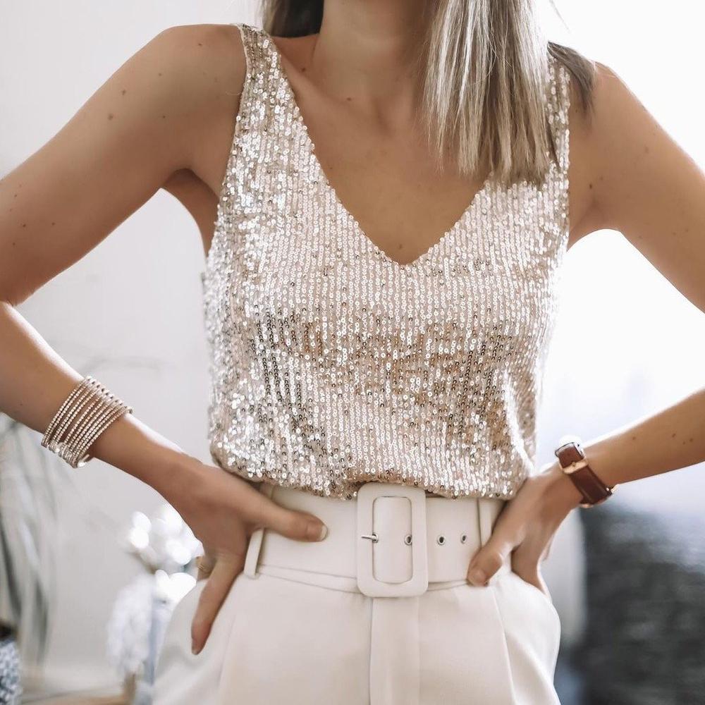 Sleeveless sparkling sequin top for women, featuring elegant spaghetti straps for a glamorous look.