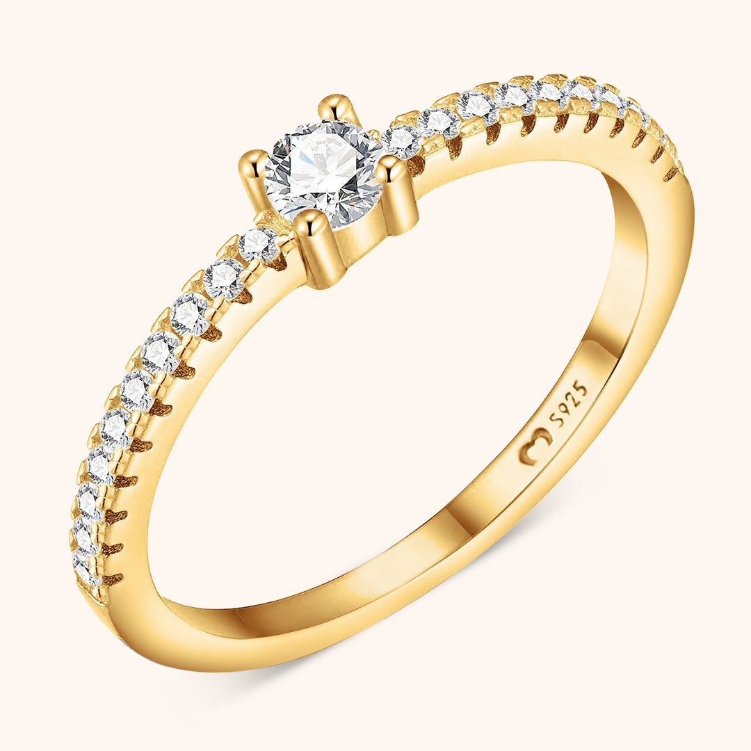 Women's sparkling zirconia solitaire ring in gold plated sterling silver. Elegant fashion jewelry, perfect gift for her.