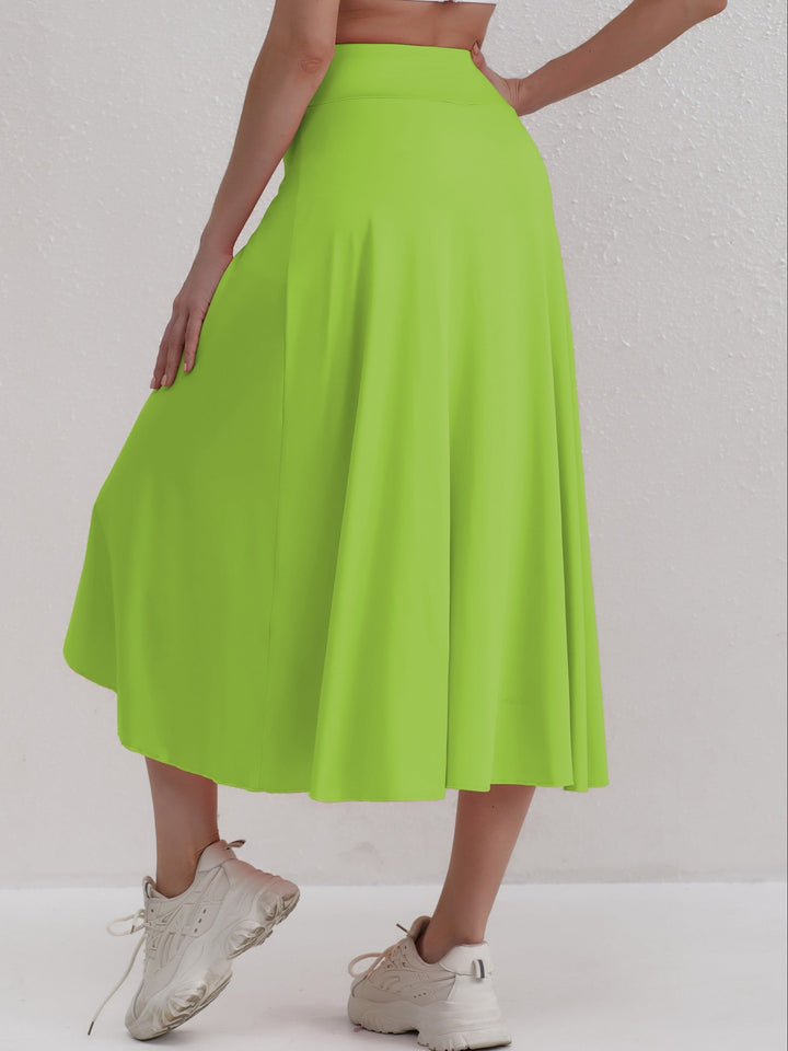 Fashionable women's asymmetric sporty skirt with high waistband. Ideal for activewear and travel.