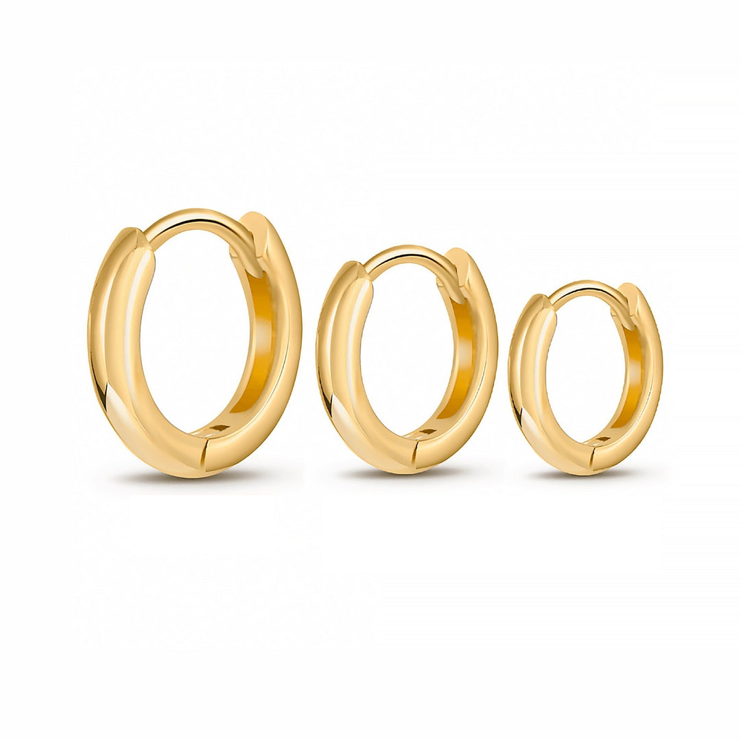Close-up of a women's sterling silver & gold stackable hoop earring set, ideal for modern fashion & gifts.