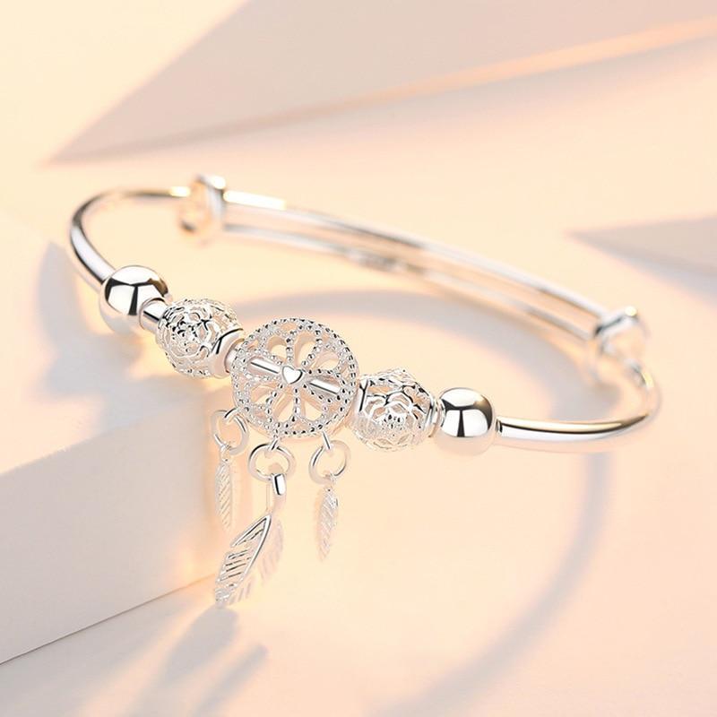 Women's sterling silver adjustable dreamcatcher bracelet, perfect boho jewelry for protection & style.