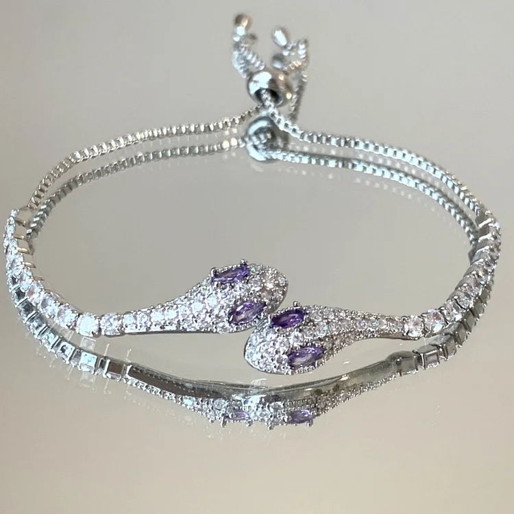 Sparkling women's silver snake bracelet adorned with zirconia stones, a perfect elegant gift for her.