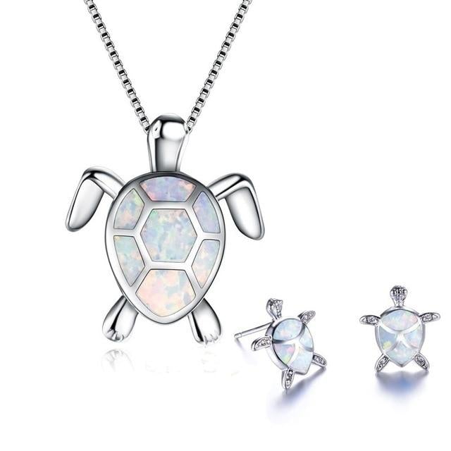 Dainty women's sterling silver turtle necklace and vibrant opal gemstone earrings set.