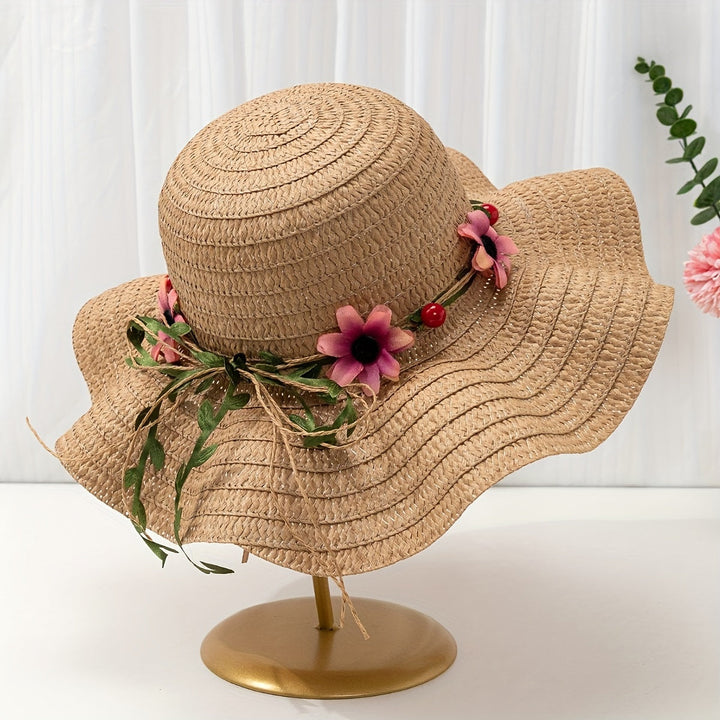 Vacation-ready women's straw beach hat with vibrant floral and fruit decorations.