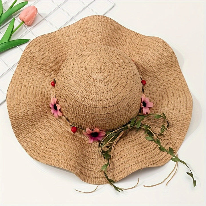 Elegant women's straw summer hat, adorned with delicate floral & fruit accents, for a chic look.