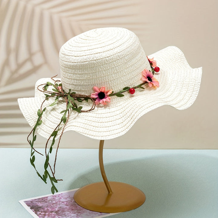 Elegant women's straw sun hat with colorful floral & fruit accents, great for summer garden parties.