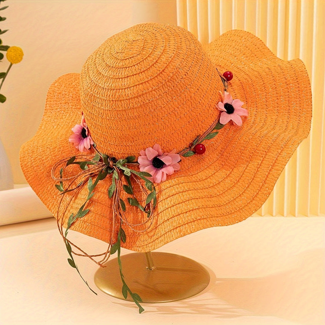 Woman wearing a stylish straw summer hat with vibrant floral & fruit decorations on the beach.