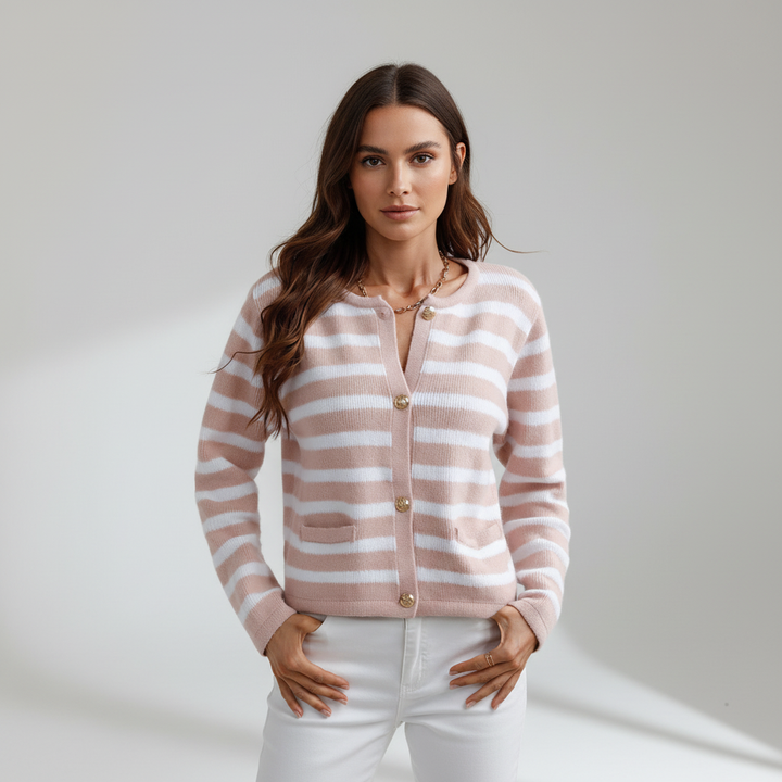 Close-up of a women's striped knit cardigan showing the gold button detail and soft fabric texture.