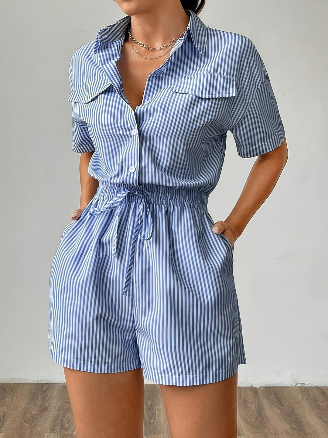 Women's striped short sleeve summer jumpsuit with button front, ideal for casual wear.