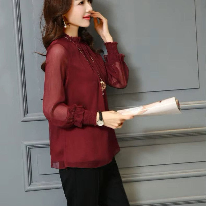 Elegant women's chiffon blouse featuring stylish ruffles & delicate sheer puff sleeves. Perfect for summer fashion.