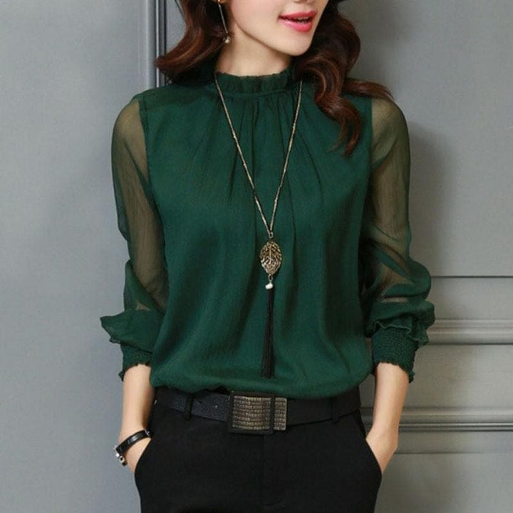 Fashionable women's solid color blouse with ruffle details & sheer sleeves. Ideal for spring and summer elegance.