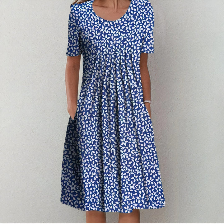 Stylish women's casual summer dress. Comfortable midi cotton design, ideal for spring fashion & travel.