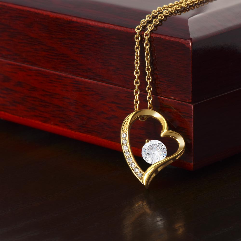 Women's stylish gold heart necklace, symbol of love & connection. Delicate anniversary gift jewelry.