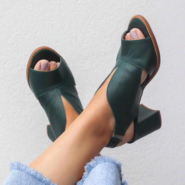 Fashionable women's heeled leather sandals, featuring an ergonomic footbed for ultimate comfort.
