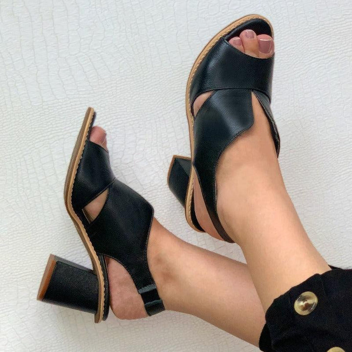 Women's heeled leather comfort sandals, perfect for sophisticated summer ensembles.