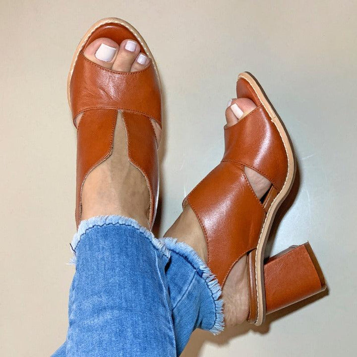 Walkable heeled leather sandals for women by Selina, with ergonomic design and stylish finish.