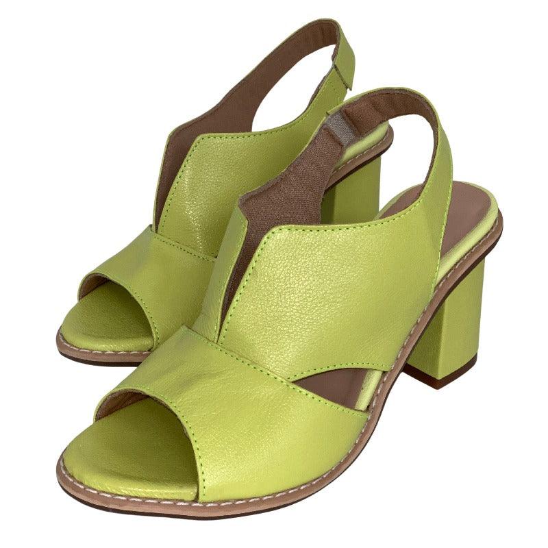 Adjustable strap detail on stylish women's heeled leather sandals with ergonomic footbed.
