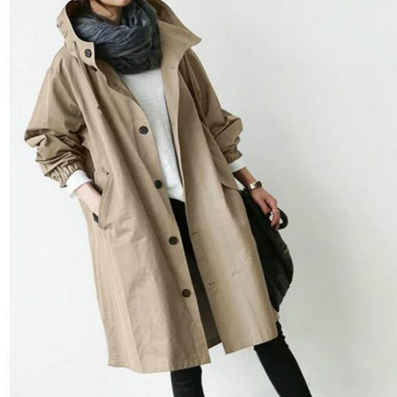 Women's stylish hooded trench coat, perfect all-weather outerwear for versatile protection and fashion.