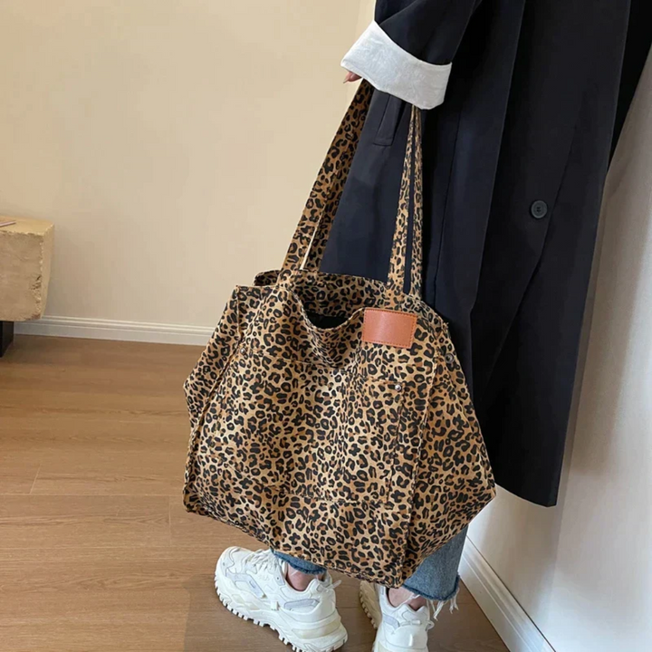 Fashionable women's tote bag with bold leopard print, offering ample storage space